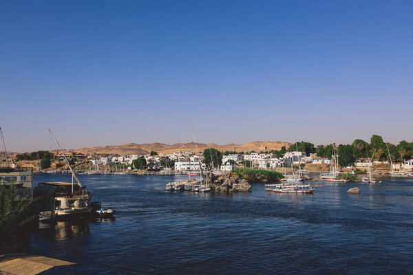 Aswan, Egypt - November 15, 2020: View to the Nile River Panoramic View with Ships and Boats from the Aswan Riverside