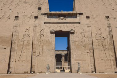 View to the main entrance of an Ancient Egyptian Edfu Temple showing the first pylon in the Sunny Day, Egypt