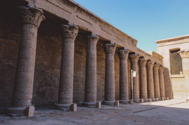 Interior View of the Temple of Edfu with Carved Pillars and Ancient Egyptian Drawing on the Wall, Egypt 