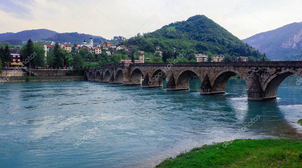 View in the Rainy Day to the historic Mehmed Paa Sokolovi Bridge Bridge in Viegrad, over the Drina River, Bosnia and Herzegovina