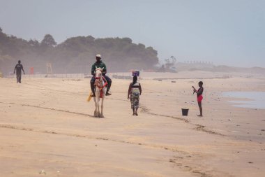 Accra, Ghana - April 06, 2022: Local African People having Fun on the Ghana Ocean Coastline 