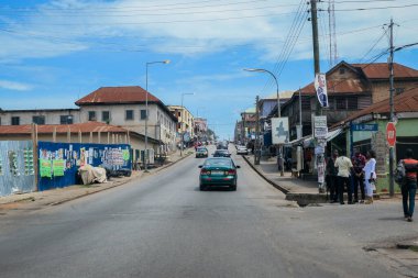 Kumasi, Ghana - April 06, 2022: Crowded African Road with Local Ghana People in Kumasi city