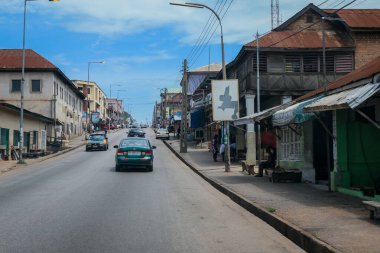 Kumasi, Ghana - April 06, 2022: Crowded African Road with Local Ghana People in Kumasi city