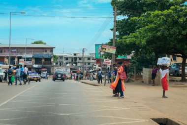 Kumasi, Ghana - April 06, 2022: Crowded African Road with Local Ghana People in Kumasi city