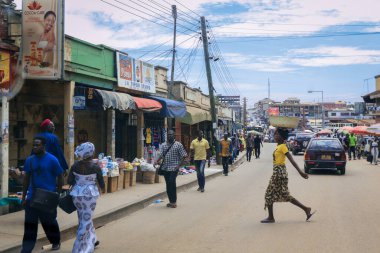 Kumasi, Ghana - April 06, 2022: Crowded African Road with Local Ghana People in Kumasi city