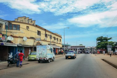 Kumasi, Ghana - April 06, 2022: Crowded African Road with Local Ghana People in Kumasi city