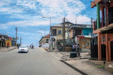 Kumasi, Ghana - April 06, 2022: Crowded African Road with Local Ghana People in Kumasi city