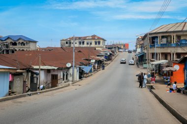 Kumasi, Ghana - April 06, 2022: Crowded African Road with Local Ghana People in Kumasi city