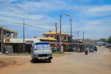 Kumasi, Ghana - April 06, 2022: Crowded African Road with Local Ghana People in Kumasi city