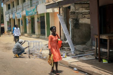 Kumasi, Ghana - April 06, 2022: Crowded African Road with Local Ghana People in Kumasi city