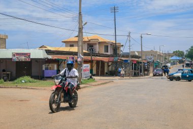 Kumasi, Ghana - April 06, 2022: Crowded African Road with Local Ghana People in Kumasi city