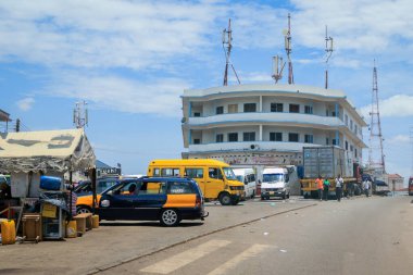 Kumasi, Ghana - April 06, 2022: Crowded African Road with Local Ghana People in Kumasi city