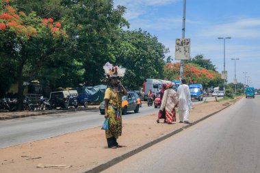 Kumasi, Ghana - April 06, 2022: Crowded African Road with Local Ghana People in Kumasi city