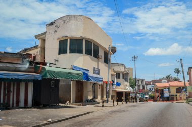 Kumasi, Ghana - April 06, 2022: Crowded African Road with Local Ghana People in Kumasi city