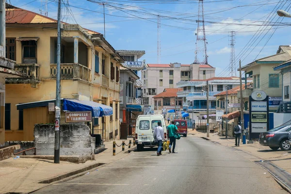 Kumasi, Ghana - April 06, 2022: Crowded African Road with Local Ghana People in Kumasi city