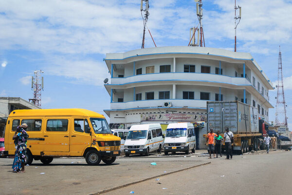 Kumasi, Ghana - April 06, 2022: Crowded African Road with Local Ghana People in Kumasi city