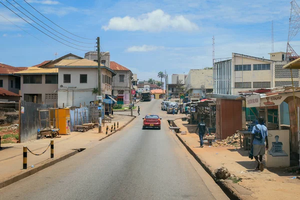 Kumasi, Ghana - April 06, 2022: Crowded African Road with Local Ghana People in Kumasi city