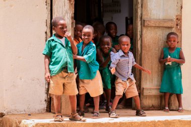 Amedzofe, Ghana - April 2022: African Pupils in Colorful School Uniform near the small Ghana Amedzofe town
