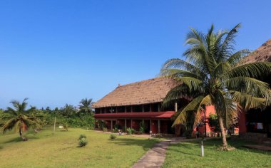 Traditional African Houses on the Axim Tropical Beach in Ghana, West Africa