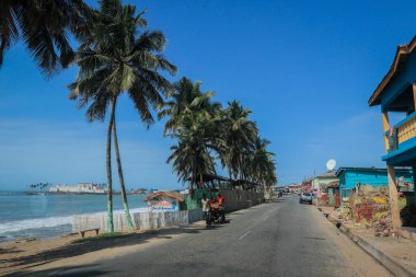 Empty African Asphalt Road among the Palm Trees near Cape Coast in Ghana, West Africa