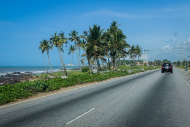 Empty African Asphalt Road among the Palm Trees near Cape Coast in Ghana, West Africa