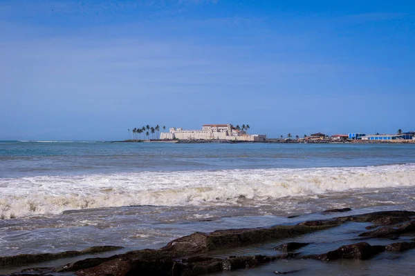 Far View to the Cape Coast Slave Castle from the  Atlantic Ocean Coastline in Ghana, West Africa