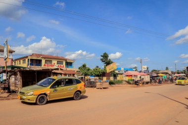 Cape Coast, Ghana - April 14, 2022: Cityscape of Local African Cape Coast town with Ghana People and Cars on the street