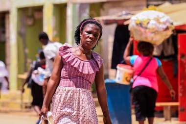 Elmina, Ghana - April 15, 2022: Local African People near the Elmina Market in Ghana