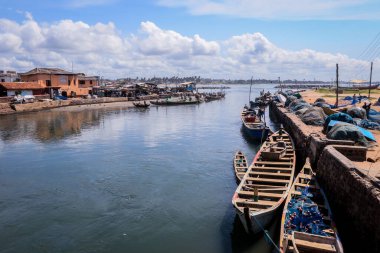 Atlantic Ocean View in the Elmina port with Boats and small Ships in Ghana, West Africa