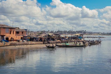 Atlantic Ocean View in the Elmina port with Boats and small Ships in Ghana, West Africa