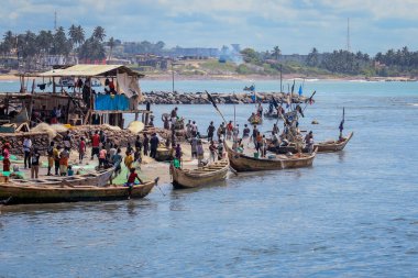 Atlantic Ocean View in the Elmina port with Boats and small Ships in Ghana, West Africa