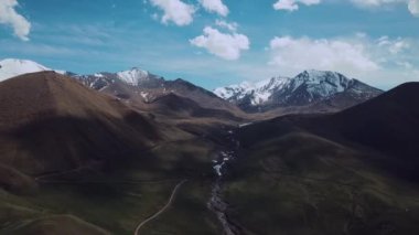 Highlands With Clouds And Snow-Capped Peaks, Aerial View