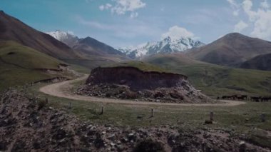 Highlands With Clouds And Snow-Capped Peaks, Aerial View