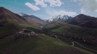 Highlands With Clouds And Snow-Capped Peaks, Aerial View