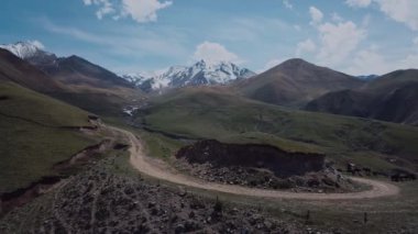 Highlands With Clouds And Snow-Capped Peaks, Aerial View
