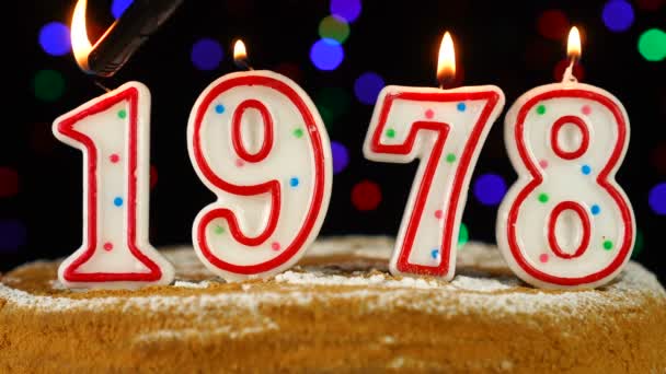 Birthday cake with white burning candles in the form of number 1978 — Stock Video