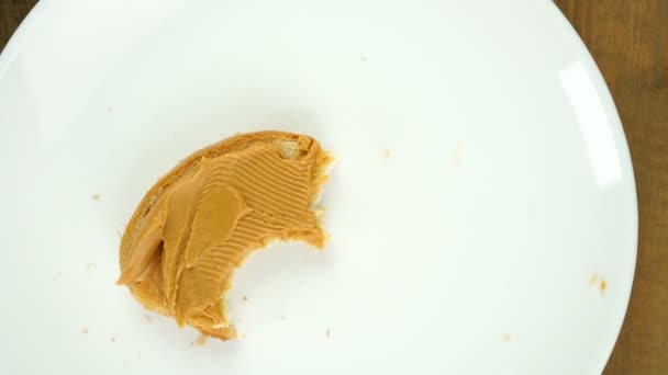 Stop motion animation of eating vegan food peanut butter bite by bite. — Stock Video