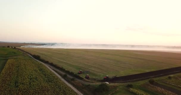 Countryside. Tractors are preparing to plow the field. — Stock Video