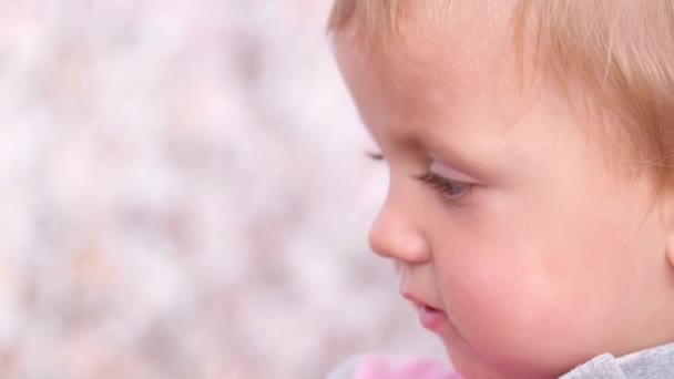 Beautiful face of a little girl with big eyes. — Stock Video