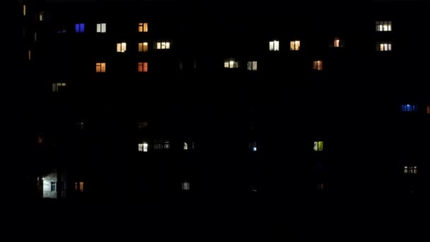 Time lapse of a night house, in which the light is turned on and off. — стоковое видео