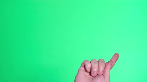 Gestures on a green background. A male hand touches, clicks, presses, slides, swipes, and swipes — Vídeo de stock