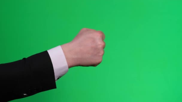 Gestures on a green background. Male hand fist beats on chromakey — Vídeo de Stock