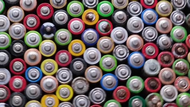 Close-up of used oxidized AA batteries. Finger batteries rotate in a circle. — Video