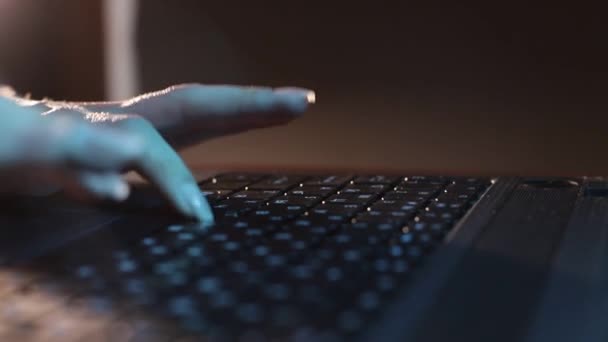The hacker works on the computer at night, the person-programmer types the code — Video Stock