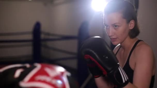 Two female boxers sparring in the ring. Girls practice punches in training. — Stock Video