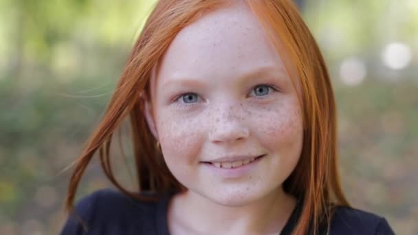 Natural appearance of a girl with beautiful freckles on her face. — Video