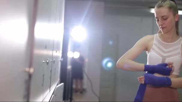 Girl Boxer Preparing Workout Gym She Rolls Bandages Her Hands — ストック動画