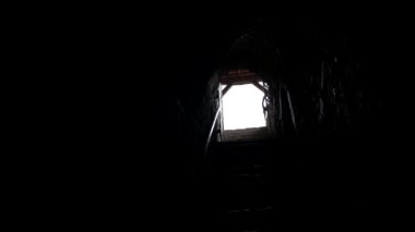 Bright light at the end of the tunnel, slow motion of the camera.