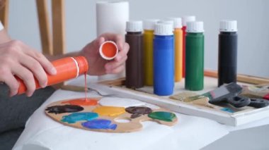 Super slow motion 240 fps, the artist paints an abstract picture in the studio.
