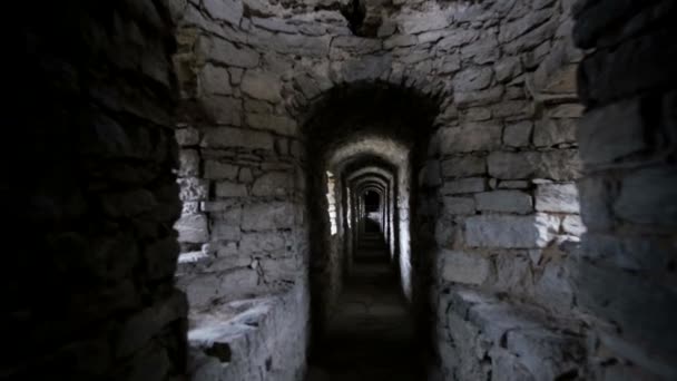 Dark corridors in an ancient castle. long stone corridor with windows in a medieval castle — Video Stock